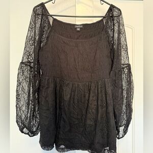 NWOT Torrid peplum style, smocked top with sheer lace sleeves.